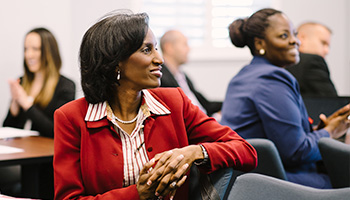 adult students smiling in class