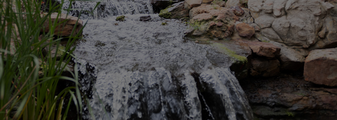 waterfall with rocks and greenery