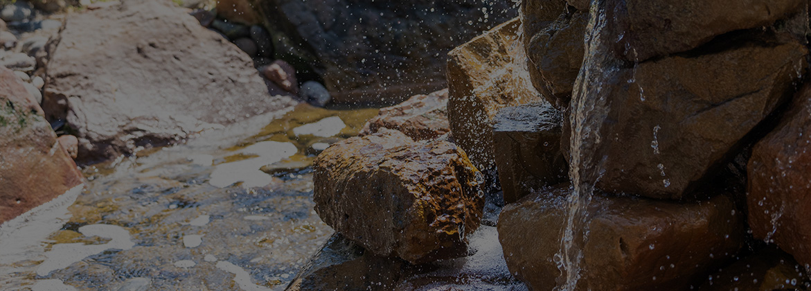 rocks with trickling water and creek