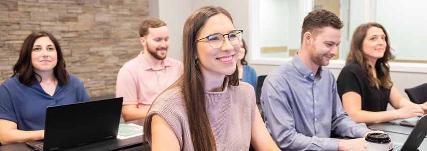 DBU students smiling in classroom