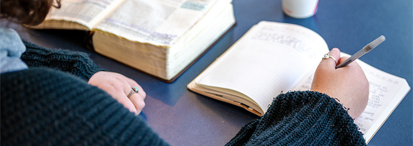 DBU student studying on campus