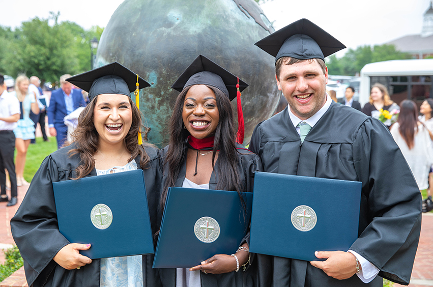 graduates holding degrees at dbu