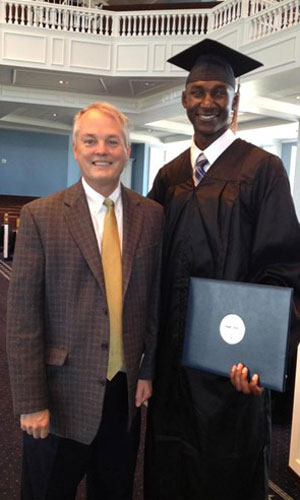 Ishmael grad photo with gary cook