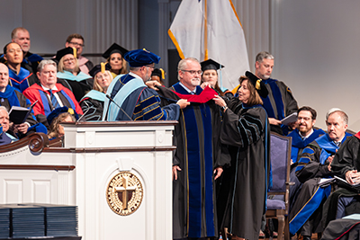 Dr. David Fleming on stage at DBU's spring commencement