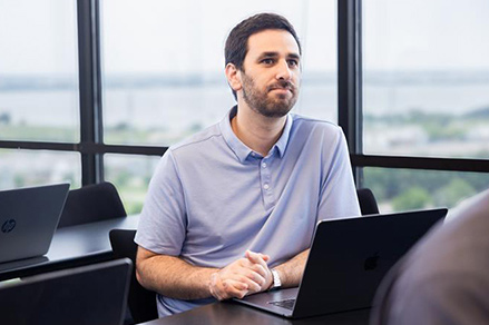 picture of a man sitting in a classroom
