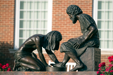 picture of the man washing Jesus's feet statue