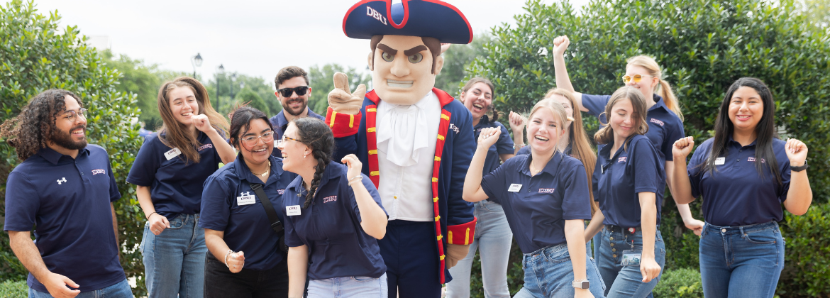 DBU students dance while Patriot Man, the official DBU mascot, poses